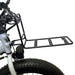 Black bike rack attached to a bicycle on a white background